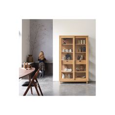 a wooden cabinet with glass doors and shelves