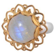 This gorgeous ring has been handmade in our workshops. We have used jaali and embossed work and embedded it with a rainbow moonstone. It has matching earrings, pendant and bracelet. It is made in sterling silver with 24ct gold vermeil. Ring dimensions - 22m x 22mm. It is available in sizes UK - M, N, O, P or USA - 6 1/4, 6 3/4, 7 1/4, 7 3/4 Gold Moonstone Round Jewelry, Yellow Gold Moonstone Jewelry, Unique Yellow Gold Moonstone Jewelry, Unique Yellow Gold Moonstone Ring, Handmade Yellow Gold Moonstone Ring In Sterling Silver, Hand Forged Moonstone Jewelry In Yellow Gold, Celestial Hallmarked Jewelry With Oval Stones, Celestial Style Hallmarked Oval Jewelry, Celestial Moonstone Jewelry In Yellow Gold