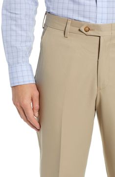 Classically tailored flat-front pants are crafted from smooth microfiber that resists water and stains to keep you looking sharp. 18" leg opening; 11 1/2" front rise; 17" back rise Zip fly with button-tab closure Side slant pockets; back button-welt pockets Water and stain resistant 100% polyester Dry clean Imported Fitted Full Length Chinos For Business Casual, Elegant Tailored Bottoms With 5-inch Inseam, Tailored Solid Full-length Bottoms, Tailored Full Length Solid Bottoms, Spring Business Casual Pants With Standard Cut Leg, Fitted Straight Leg Pants With Hidden Pockets, Classic Chinos With 4-way Stretch For Business Casual, Classic Slim Fit Pants With Belt Loops, Classic Tapered Leg Bottoms With Belt Loops