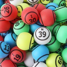 colorful balls with numbers are piled on top of each other