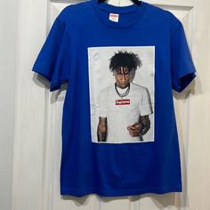 Brand-New, Collectible, Supreme Youngboy T-Shirt, Size Small, Call Aaron Royal Blue. It Is A Little Bit Of Pulling On The Canvas With That Showed In The Picture. No Big Flos Prices Discounted. Blue Crew Neck Shirt For Streetwear, Casual Blue Tops For Streetwear, Trendy Blue Tops For Streetwear, Trendy Blue Shirt For Streetwear, Casual Blue Shirt For Streetwear, Supreme Box Logo Tee, Supreme Tshirt, Supreme Shirts, Supreme T Shirt