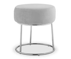 a white stool with chrome legs and a round foot rest on it's side