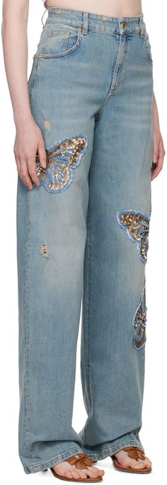 Relaxed-fit stretch denim jeans. Fading, whiskering, and distressing throughout. · Belt loops · Five-pocket styling · Zip-fly · Sequinned graphics embroidered at legs · Extended cuffs · Logo patch at back waistband · Logo-engraved gold-tone hardware · Contrast stitching in beige Supplier color: Country blue Butterfly Jeans, Rick Owens Lilies, Charlotte Chesnais, Country Blue, Embroidered Jeans, Versace Jeans Couture, Contrast Stitch, Stretch Denim, Patch Logo