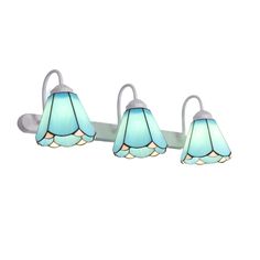 three blue lamps are hanging from a white light fixture in the shape of a flower