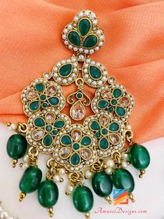 Polki Green Emerald Earrings Tikka Set. Available to shop online and delivered to your doorsteps anywhere in the world with our Everything-Everywhere FREE Shipping. 📦Unmatched FREE Worldwide Shipping EXPLORE more Maang Tikka Sets and Tikka Set Punjabi, INDIAN JEWELRY SETS Match with our pretty Single Line Necklaces Preet, Canada ⭐️⭐️⭐️⭐️⭐️ The payal I ordered was amazing 🤗 I got it in 3-4 days in a beautiful box with thank you note. Such an amazing experience with amazel designs. Thank you Kir Green Dangle Bridal Earrings For Festivals, Green Dangle Hoop Earrings For Celebration, Green Chandelier Earrings For Festivals And Gifts, Traditional Green Pearl Drop Earrings, Green Traditional Chandelier Earrings As Gift, Traditional Green Chandelier Earrings As Gift, Traditional Green Chandelier Earrings For Gift, Festive Green Single Earring Jewelry, Festive Green Earrings For Gift