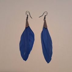 "This pair was handcrafted on February 20th, 2023 in the Upper Peninsula of Michigan.   Handmade with two staggered blue feathers which were set into a copper end tube with jewelry glue. The set was finalized with a copper ear wire.  Approximately 3/4\" wide and 3 3/4\" long from top of ear wire to bottom of earring.  Thank you for viewing 💙🪶" Blue Feathers, Earrings Feather, Boho Feathers, Natural Jewelry, Duck Feather, Feather Jewelry, Blue Feather, Upper Peninsula, Jewelry Blue