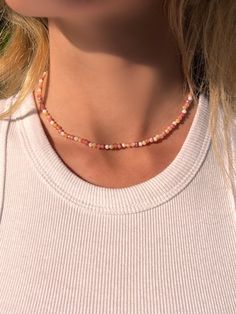 This beautiful gemstone choker sparkles in a summery palette of pink, sunny yellow and white tones. Carefully selected gemstones such as rhodochrosite and sunstone create a holiday feeling in their warm colors. The beads of the gemstone necklace are 2-3 mm in size and faceted. All gemstones are genuine and high quality. The clasp is made of stainless steel, so the chain lasts a long time and does not rub off on the skin. DIMENSIONS & DETAILS 🌴 Material: real gemstone beads 🌴 Rhodochrosite, Qua Colorful Pearl Necklace, Pearl Necklace Pink, Choker Pearl Necklace, Pink Gemstone Necklace, Choker Pearl, Pearl Necklace Choker, Pink Choker, Pink Pearl Necklace, Gemstone Choker