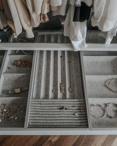 an open drawer with jewelry on it