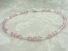 Light pink Crystals are used to create this pretty anklet! Sterling silver plated beads, seed beads and Crystals make this piece simply elegant. A sterling silver plated lobster clasp and sterling silver plated soldered jump ring are used for added strength and security. This light pink Swarovski Crystal is the birthstone for October! Elegant Adjustable Pink Anklets, Elegant Pink Adjustable Anklets, Pink Anklet, Pink Beaded Bracelet, Pink Beaded Bracelets, Wedding Anklets, Poughkeepsie Ny, Beautiful Anklet, Crystal Anklet