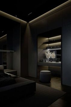 a dimly lit room with black furniture and lighting