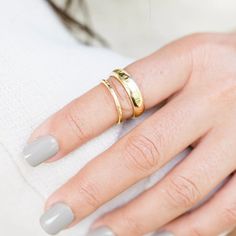 The Bright Light Wedding Band set is so special! It features a delicately round, 1.25mm handhammered 14k gold band for her, and a 5x1.25mm half rounded textured band for him. Both handcrafted to catch the light in any space, a shared sparkle, a sp... Hammered Gold, Bright Light