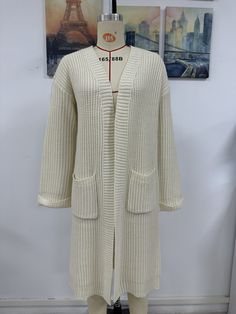 F00194583-402 Knitted Cotton Outerwear For Cold Weather, Beige Cotton Knitted Sweater, Cozy Long Sleeve Ribbed Outerwear, Cozy Fitted Sweater Coat With Pockets, Acrylic Knit Long Sleeve Outerwear, Winter Cotton Knit Outerwear, Beige Cotton Sweater For Winter, Casual Knitted Sweater Coat, Winter Knitted Cotton Cardigan