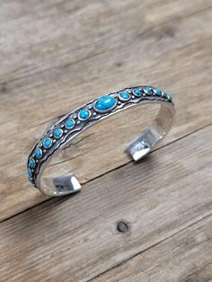 10 mm Turquoise cuff bangle  Dimensions   L X W   7.5 inch x 10 mm  All our Silver Jewelry are 925 stamped and 92.5% Pure Sterling silver. We do not use Nickel.  The stones used in our Jewelry are all Natural Gemstones  💎. The item listed in the page is the actual item for sale. We have listed the dimensions of the Jewelry in item details. If you should require any other specific dimensions, please message us . 📦Shipping & Exchange of items ----------------------------------------------- 30 Da Turquoise Sterling Silver Bohemian Bangle, Bohemian Turquoise Sterling Silver Bangle, Gem Show, Sterling Silver Bangle, Turquoise Cuff, Jewelry Boho, Sterling Silver Bangles, Silver Bangle, Cuff Bangles