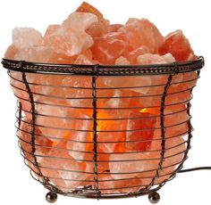 a wire basket filled with orange crystals