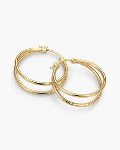 Our women's X Hoop Earrings in gold showcase double hoops intertwined for a chic and dynamic design. Crafted with a polished finish and a 925 sterling silver post, these earrings add a touch of contemporary flair to any ensemble. Solid Gold Chains, Earrings In Gold, Dynamic Design, Large Hoop Earrings, Silver Shop, Men's Rings, Pendant Bracelet, Chain Pendants, Chain Bracelet