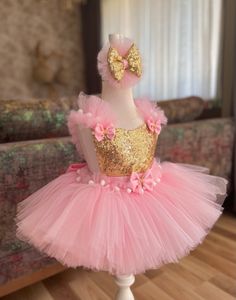 Introducing our Exquisite Pink & Gold Tutu Dress for Kids and Babies - A Magical Fairy Dress Delight! Prepare for enchantment with our meticulously crafted Pink & Gold Tutu Dress. Perfect for 1st-year birthdays, Halloween, festivals, special occasions, adorable toddler girl costumes, and as a stunning first birthday dress, this creation is a true showstopper. 👑 Unmatched Comfort: Soft Tutu on the outside, cotton lining on the inside. No itching or irritation, just pure comfort for your little fairy. 🌟 Tailored Perfection: Fully customizable for a perfect fit. Adjustable straps and elastic waist ensure your baby girl feels comfortable and looks amazing. 💖 Superior Craftsmanship: Sewn with love, this fairy dress stands out from the crowd. ✨ Unveiling the Extraordinary: 1️⃣ Premium Quality Pink Princess Dress For Christmas Party, Christmas Princess Dress In Pink, Pink Fairytale Fairy Dress For Party, Whimsical Tutu Dress For Easter Dress-up, Princess Style Tutu Dress For Party Season, Pink Tulle Tutu Dress For Christmas, Easter Party Tutu Dress With Ruffles, Pink Princess Dress For Carnival, Fitted Pink Princess Dress For Festive Occasions