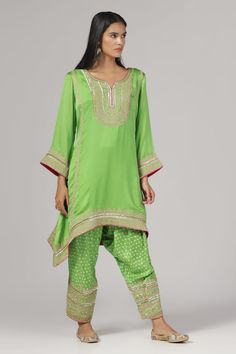 Green silk chanderi kurta with zari and aari embroidery. Comes with salwar. - Aza Fashions Dola Silk Kurta With Gota Work, Dola Silk Kurta With Gota Work In Traditional Drape, Bollywood Style Silk Kurta For Festivals, Festival Silk Kurta With Cutdana, Silk Kurta With Cutdana For Festivals, Silk Traditional Wear With Gota Work For Festivals, Bollywood Raw Silk Kurta With Cutdana, Navratri Traditional Raw Silk Wear With Gota Work, Transitional Cotton Silk Traditional Wear With Dori Work