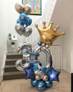 some balloons are in the shape of a king and queen's crown