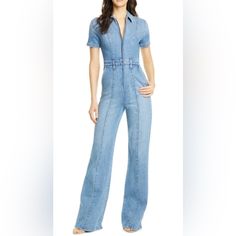 This Wide-Leg Denim Jumpsuit Cut From Light-Wash Stretch Denim Stays True To Its 70s Roots With Center Stitched Seams Running From Shoulder To Hem. (Nwt Front Zip Closure Spread Collar Short Sleeves Front Slant Pockets Belt Loops Lined 98% Cotton, 2% Bust 16.5” Waist 13.5” Inseam 33.5” Fitted Medium Wash Denim Jumpsuit For Work, Fitted Wide Leg Overalls With Pockets, Denim Jumpsuits And Rompers With Short Sleeves, Fitted Straight Leg Denim Jumpsuit For Work, Fitted Denim Blue Jumpsuit For Work, Fitted Wide Leg Denim Jumpsuit, Fitted Denim Jumpsuit With Wide Legs, Fitted Wide Leg Overalls For Workwear, Fitted Wide-leg Denim Jumpsuit