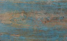 an old blue wooden surface with peeling paint