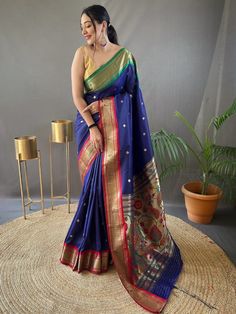 Wear this stunning navy blue zari woven Paithani silk reception saree and become the epitome of grace and elegance. This beautiful saree is crafted with precision and detail to ensure that you look your best on any occasion. Made from high-quality silk material in a rich navy blue color, this saree is a true masterpiece.
The exquisite zari weaving work adds a touch of sophistication and luxury to the saree. The intricate golden motifs all over the saree enhance its beauty and make it a perfect c Paithani Saree Traditional Look, Paithani Silk Saree, Reception Saree, Navratri Dress, Trendy Sarees, Wear Saree, Trendy Prints, Blouse Material, Saree Online