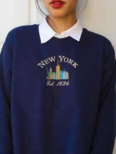 This vintage inspired crewneck features an embroidered design of New York's skyline. Whether it's for yourself or a gift, get cozy, comfy, and stylish with this embroidered sweatshirt. Crewnecks are embroidered with a one-of-a-kind design inspired by places, experiences, and adventures! ⭐  PRODUCT DETAILS * Unisex Sizing * Sweatshirts: 50% cotton, 50% polyester * T-Shirts: 100% cotton * Size up 1-2 sizes for a looser comfy fit ⭐  CARE INSTRUCTIONS Wash with cold water. Hang drying is recommended Affordable Vintage Sweatshirt With Embroidered Logo, Luxury Navy Sweatshirt With Embroidered Logo, Cheap Blue Tops With Embroidered Logo, I Love New York Sweater, Luxury Blue Sweatshirt With Embroidered Logo, Luxury Embroidered Sweatshirt, Sweater Designs, Ville New York, Ny City