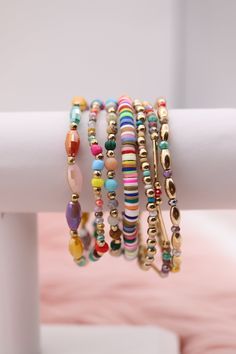 Enhance your accessory game with our Gold Mixed Up Multicolored Beads Bracelet Set. This set features a mix of gold and multicolored beads for a unique and stylish look. Perfect for any occasion, you'll love the versatility and eye-catching design of this set. Elevate your style with this must-have accessory. Size: 6.5” - Inner Diameter Closure: Elastic Material: Zinc, Brass and Steel with Rhodium Plating Lead and Cadmium Safe - It is not Nickel Free Adjustable Multicolor Jewelry With Gold Beads, Multicolor Friendship Bracelets With Gold Beads For Beach, Multicolor Gold Beads Friendship Bracelet For Beach, Multicolor Stackable Beaded Bracelets For Party, Trendy Gold Beaded Bracelets With Spacer Beads, Multicolor Metal Beaded Bracelets, Multicolor Heishi Beads Jewelry With Colorful Beads, Colorful Bohemian Beaded Bracelets For Party, Colorful Round Beads Bracelets For Party