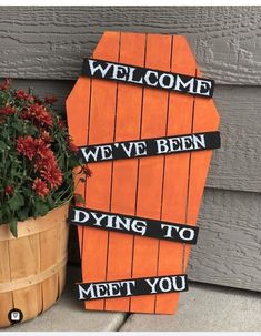 a wooden sign that says, welcome we've been dying to meet you