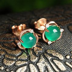 The warm stones of goldtone metal highlight the vibrant green color of these earrings punctuated by the bright sparkle of cubic zirconia. 0.39'' W x 0.31'' H Goldtone copper / lab-created jade / cubic zirconia Ring Purple, Green Chalcedony, Flower Vintage, Green Jewelry, Emerald Earrings, Romantic Gift, Fine Jewelry Gift, 925 Jewelry, Stone Earrings