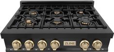 a black and gold stove top with four burners