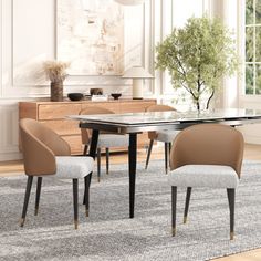 a dining room table with chairs and a vase on the floor in front of it