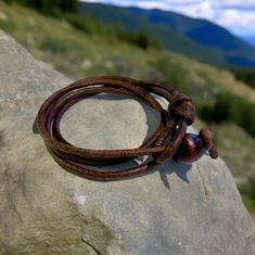 This handcrafted leather wrap bracelet offers a laid-back surfer vibe with a touch of boho style. Made from durable 3mm natural leather, it wraps 3-4 times around your wrist, with an adjustable knot-and-loop clasp. Available in multiple colors and perfect for casual, rustic looks. Embrace natural elegance today!Material: 3mm natural distressed leatherWidth: about 1/2 inch (10-12cm)Color: black, brown, navy blue or naturalLength: fit 6-7.5 inch, triple wrapClosure: knot and loop clasp.3-4 times w Brown Leather Wrap Bracelet As Gift, Brown Leather Wrap Bracelet For Gift, Brown Leather Wrap Bracelet Gift, Handmade Brown Leather Bracelet For Beach, Brown Leather Strap Wrap Bracelet Gift, Casual Brown Leather Beach Bracelet, Handmade Brown Leather Bracelet Adjustable Fit, Brown Leather Bracelet, Hand Wrapped For Everyday Wear, Brown Leather Hand-wrapped Bracelet For Everyday