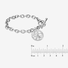 Wear this monogram charm bracelet as a constant reminder of the bond you share with someone special. Initials will appear exactly as entered. Must be three letters, center initial will be enlarged. Made in America.Metal: Rhodium-plated sterling silverClosure: ToggleDimensions: 7¼" long chainPendant Size: 20mmPersonalize: Up to 3 script initials. Initials will appear exactly as entered; center initial will be enlarged. Care: Wipe Clean Country of Origin: Made in USJewelry photos are enlarged to s Classic Engraved Charm Bracelet For Everyday, Monogram Round Bracelet For Personalized Gift, Round Monogram Bracelet For Personalized Gift, Monogrammed Round Bracelet For Personalized Gift, Personalized Monogram Round Bracelet, Classic Metal Charm Bracelet, Classic Metal Round Charm Bracelet, Classic Engraved Charm Bracelet As Personalized Gift, Classic Engraved Charm Bracelet For Personalized Gift