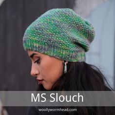 a woman wearing a green knitted hat with the words ms slouch below it