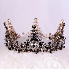 a tiara with black and white stones on it