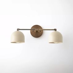 two light fixtures mounted on a wall