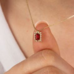 "It is a stone that represents passion, true friendship, loyalty, success and consistency. It has names such as dreaming, garnet and mercy stone.. Our Rectangle Garnet necklace surrounded by 14K Solid Gold diamonds is an elegant jewel for you and your loved ones with its elegant design. Time to pamper yourself and your loved ones... Garnet is the birthstone of January. 🤍🤍 Special gifts for your special moments. We produce our jewelery for you in the most perfect way. 🤍🤍 All of our products a Diamond Rectangular Pendant Necklace As Gift, Diamond Rectangular Pendant Necklace For Gift, Diamond Necklace With Rectangular Stone For Gifts, Diamond Necklace With Rectangular Stone As Gift, 14k Gold Necklace With Rectangular Stone For Gifts, Ruby Gemstone Birthstone Necklace Gift, Gift Emerald Cut Birthstone Necklace, Emerald Cut Birthstone Necklace Gift, Rectangular Birthstone Jewelry Gift