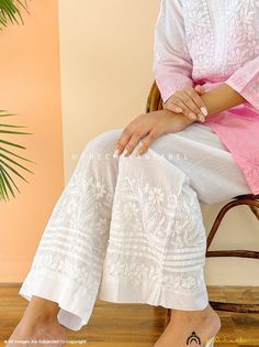 Fabric: Cotton Style: Straight Palazzo Occasions: Casual Wear, Office Wear, Party Wear Price Includes: 1 Palazzo Garment Care: Hand Wash Only Waistband: Elasticated Length: 37 Inches Waist: Fits 28-44 Inches Shop by Category: Chikankari Kurtis: https://www.etsy.com/shop/Chikanlabelbykomal?ref=seller-platform-mcnav§ion_id=41848336 Chikankari Kurta Sets: https://www.etsy.com/shop/Chikanlabelbykomal?ref=seller-platform-mcnav§ion_id=41863651 Chikankari Short Kurtas: https://www.etsy.com/shop/Chikanlabelbykomal?ref=seller-platform-mcnav§ion_id=41848338 Chikankari Sarees: https://www.etsy.com/shop/Chikanlabelbykomal?ref=seller-platform-mcnav§ion_id=41863665 Chikankari Anarkalis: https://www.etsy.com/shop/Chikanlabelbykomal?ref=seller-platform-mcnav§ion_id=41863715 Chikankari Angrakha: https://ww Traditional Set With Chikankari Embroidery And Wide Leg, Traditional Wide Leg Palazzo Set With Chikankari Embroidery, White Cotton Sharara With Self Design, Festive Wide Leg Sharara With Chikankari Embroidery, Festive Wide Leg Palazzo Set With Chikankari Embroidery, Traditional White Wide Leg Bottoms, White Bottoms With Chikankari Embroidery, Traditional White Wide Leg Sets, White Embroidered Bottoms For Eid