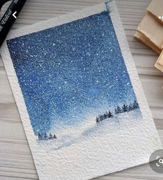 an image of a snowy night with trees and stars in the sky on watercolor paper