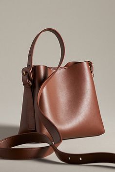 Polyurethane Removable crossbody strap One inner zip pocket Magnetic closure Imported | Mini Buckle-Strap Tote by Anthropologie in Brown, Women's Women’s Purses, Trending Bags, Hipster Clothing, Everyday Purse, Leather Tote Bags, Brown Leather Handbags, Hipster Outfits, Small Tote Bag, Fashion Aesthetics