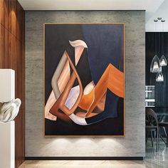 an abstract painting hangs on the wall above a dining room table with chairs and vases