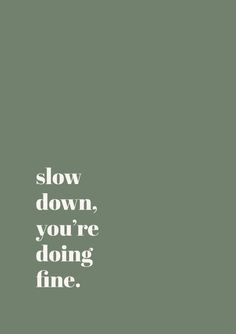 the words slow down, you're doing fine are in white on a green background