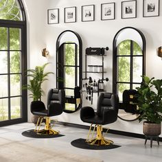 a room with chairs, mirrors and pictures on the wall above them is shown in black and gold