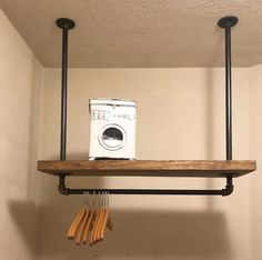 an old washer and dryer are hanging on the wall in this laundry room