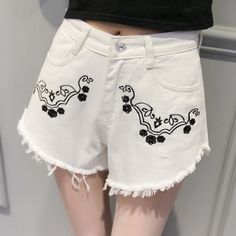 This is a simple printed shorts,it is very comfortable jeans fabric,clothes pants is very loose,plus beautiful tassel,you will feel cool in summer,simple pattern match clothes look very beautiful,if you like it,just get one.Material:DenimColor:White,BlueSize:S,M,L,XLWaistline:High WaistDecoration:TasselPocket:Side Pockets and Back PocketsPattern:PrintFit Type:LooseClose Type: ZipperOccasion:Street,BeachSeason:SummerThe accessories are not included. White Bohemian Shorts For Spring, Casual Cotton Embroidered Jean Shorts, Casual Embroidered Cotton Jean Shorts, Casual Embroidered Jean Shorts For Summer, Casual Embroidered Cutoff Shorts, Casual Spring Shorts With Tassels, Casual Tassel Shorts For Spring, Trendy Tasseled Bottoms For Summer, White Bohemian Cotton Shorts