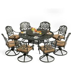 an outdoor dining table with six chairs and a small round table surrounded by brown cushions