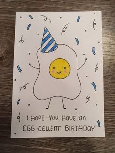 a birthday card with an egg wearing a party hat