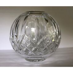 a clear glass vase sitting on top of a table