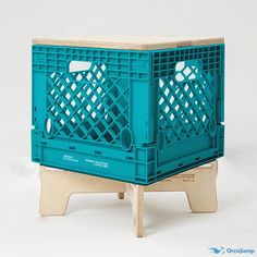 a blue crate sitting on top of a wooden stand