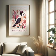 a living room with a couch, window and potted plant on the side wall